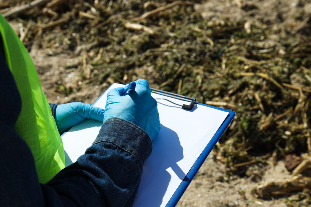 Quality inspector recording findings on site